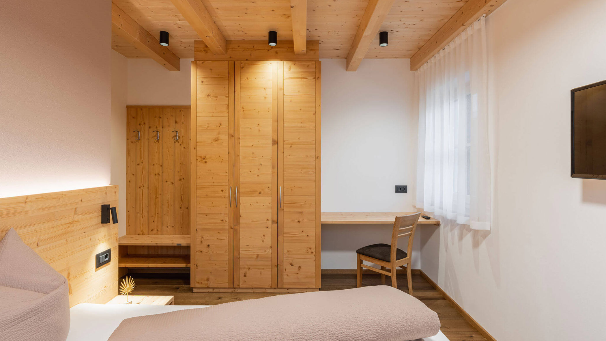 Bed with desk and wardrobe